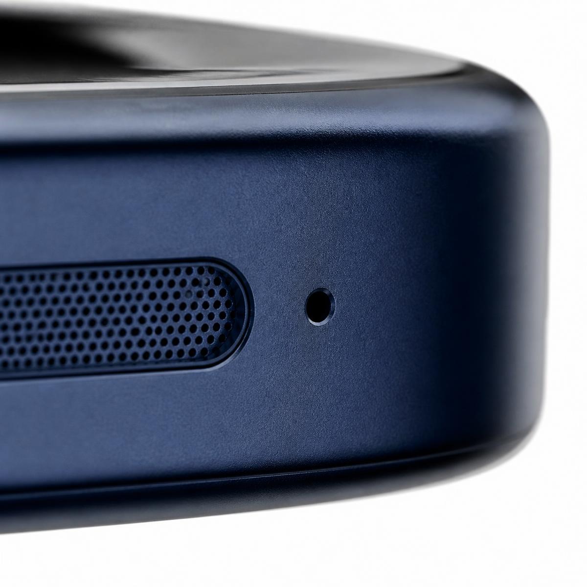 Macro view of the speaker grille and microphone pinhole