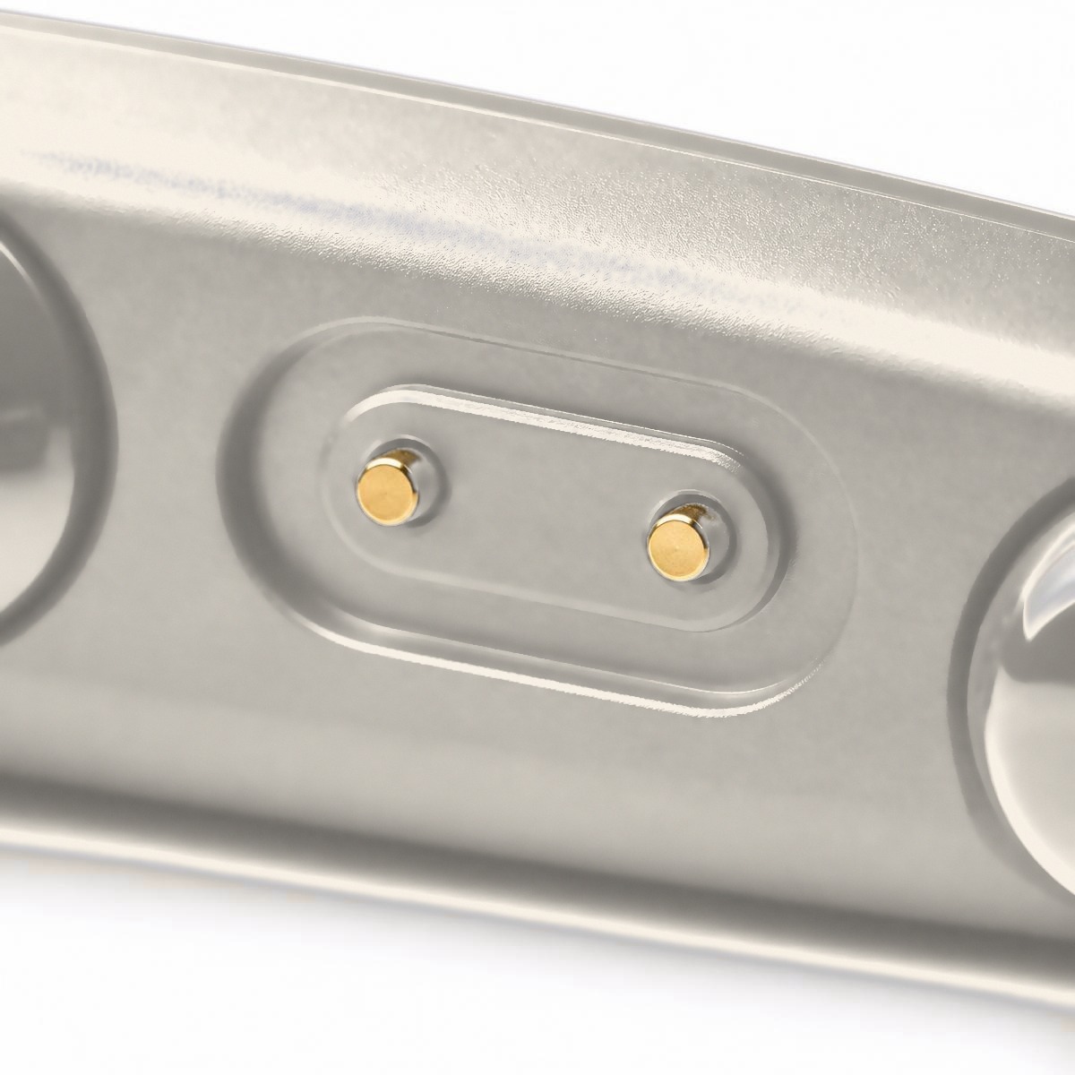 Macro view of the gold magnetic charging contacts