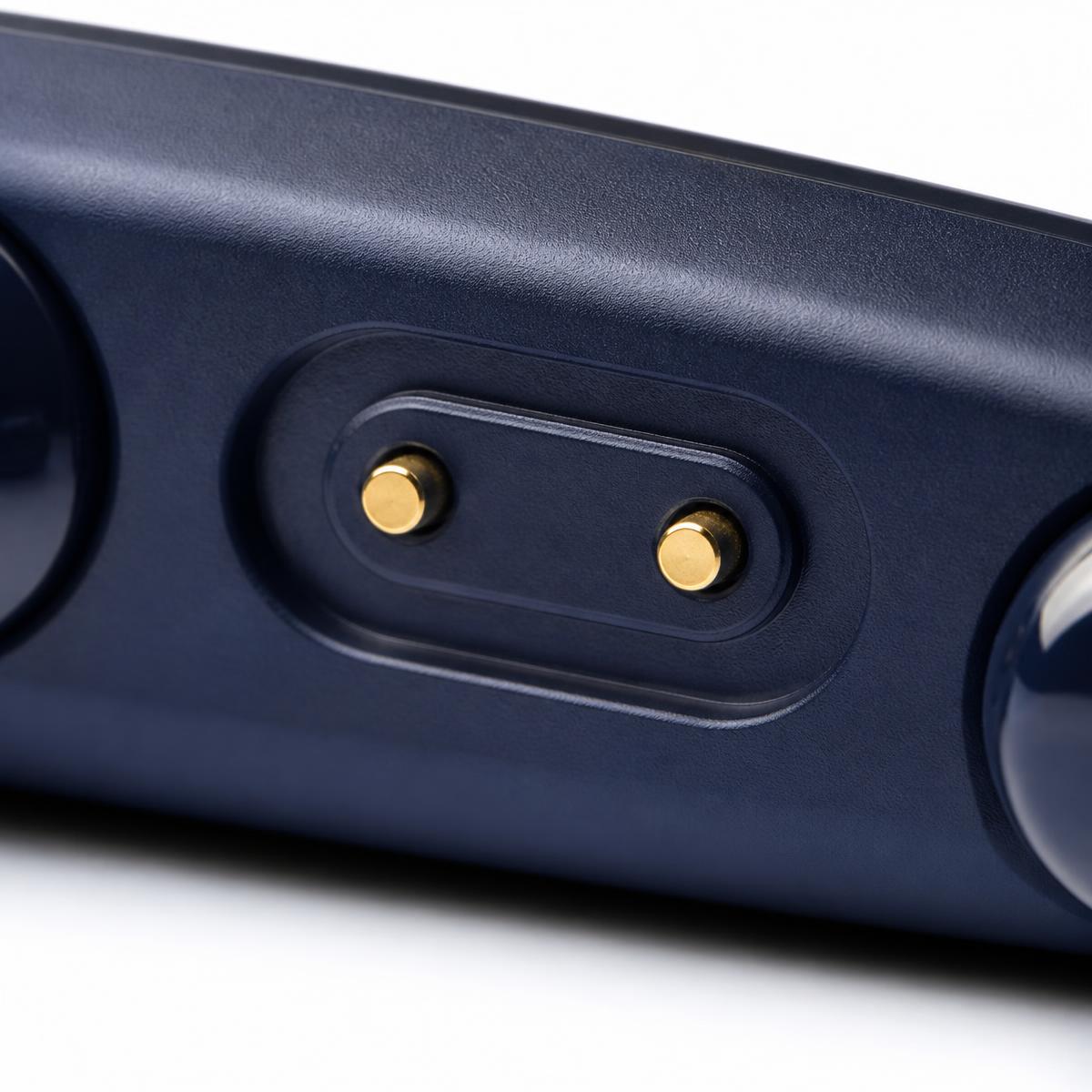 Macro view of the gold magnetic charging contacts