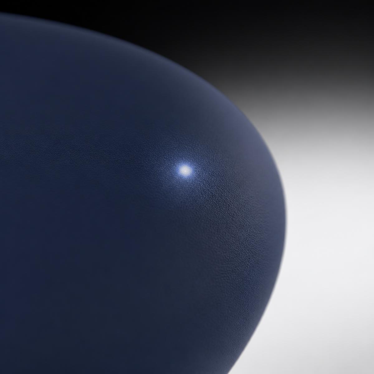 Macro view of the soft status LED glowing under the silicone